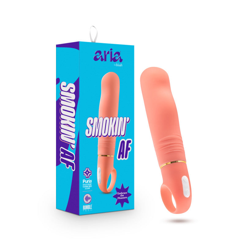 A vibrant ocean blue box showcasing the text "ARIA by blush" and "SMOKIN' AF" alongside an image of the product, a coral-colored, rounded Aria Smokin' AF Vibrator with a looped handle at the base. The toy, designed for G spot stimulation and equipped with Rumble Tech motor, is displayed standing upright next to its packaging.