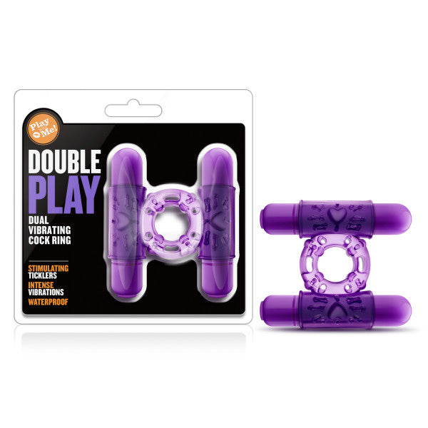 The "Play With Me - Double Play Vibrating Cock Ring" set is displayed. This purple couple's toy features two vibrating parts and stimulating ticklers, boasting intense vibrations and waterproof capabilities as highlighted on the packaging.