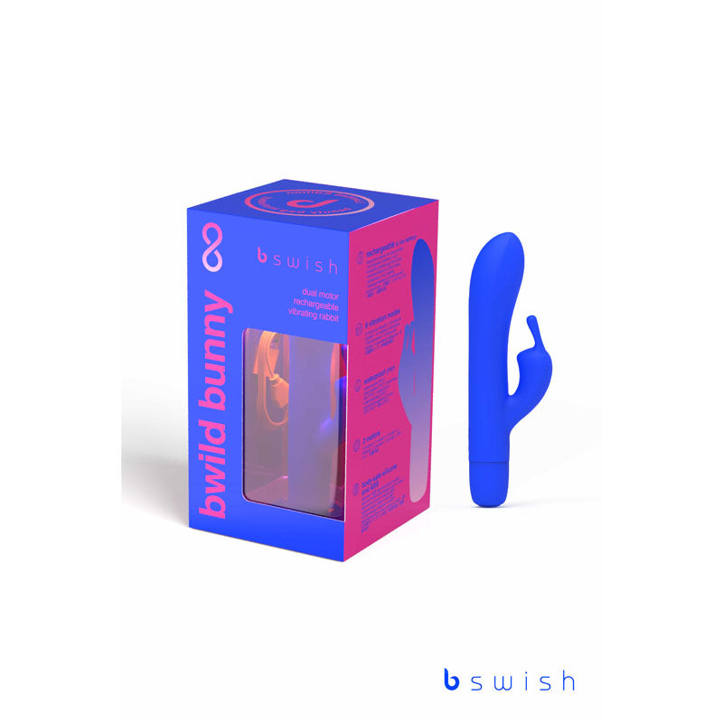 A vibrant Pacific Blue dual motor waterproof vibrator with a rabbit ear design is shown next to its matching packaging. The packaging displays the product name "Bwild Classic Bunny Infinite Limited Edition," a cutout window revealing the toy inside, and the brand logo "bswish" at the top and bottom. Made with body-safe silicone, it features a rechargeable battery for convenience.