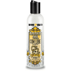 Bottle of Boneyard Snake Oil Cum Lube with a black cap. The label features yellow and white text with an illustration of a snake, indicating a hybrid lube for life.