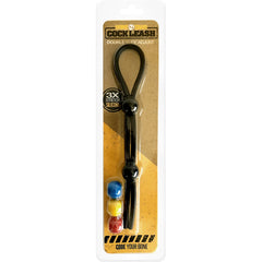 The image features a packaged product labeled "Boneyard Cock Leash Double Cock Ring," showcasing a black adjustable silicone loop accompanied by three stretchable rings in blue, yellow, and red. Made from medical-grade silicone, the packaging emphasizes "3X Stretch Silicone" and promotes the tagline "Double it, Tie it, Adjust!" for an enhanced experience.