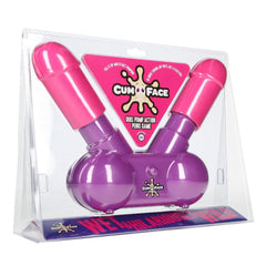 Cum Face, a packaged adult game designed as the ultimate party piece, comes with two pink-and-purple pump-action devices shaped like phallic symbols. The packaging emphasizes its dual pump action feature and includes a logo with an exaggerated splatter graphic.