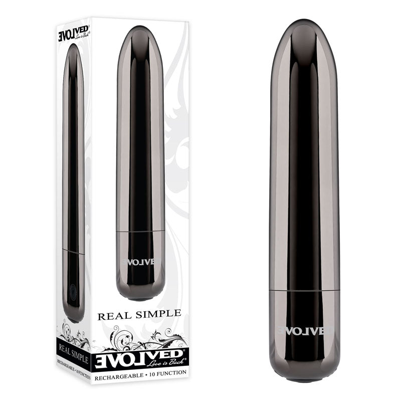 A cylindrical, metallic black chrome Evolved REAL SIMPLE bullet personal massager is displayed to the right, and its packaging box is shown to the left. The box features branding text "Evolved" and "REAL SIMPLE," highlighting attributes such as its rechargeable nature and powerful 10-function vibrating motor. The device is also water-submersible.