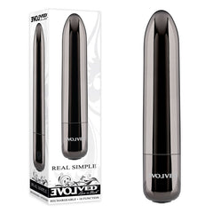 A cylindrical, metallic black chrome Evolved REAL SIMPLE bullet personal massager is displayed to the right, and its packaging box is shown to the left. The box features branding text "Evolved" and "REAL SIMPLE," highlighting attributes such as its rechargeable nature and powerful 10-function vibrating motor. The device is also water-submersible.