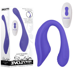 A blue, U-shaped silicone vibrator displayed with its box and a white remote control. The product, labeled "Evolved ANYWHERE VIBE Vibrator," features a dual-end flexible vibe with 9 vibrating speeds and functions. The box highlights intense vibrations from two motors for intense internal and external pleasure.