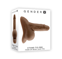 A product box labeled "Gender X STAND TO PEE - Dark" containing a realistic stand-to-pee funnel in a dark skin tone. The text on the box reads "Stand to Pee" and "Made of Body Safe TPE, Latex Free." Images on the box showcase the product from various angles, emphasizing its life-like textures.