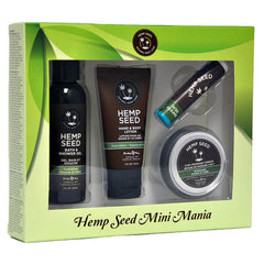 A boxed set labeled "Hemp Seed Mini Mania - Guavalava (Guava & Blackberry) Scented Lotion Kit - 4 Piece Set" contains four nutrient-rich hemp seed oil products: a bath & shower gel, hand & body lotion, lip balm, and 3-in-1 massage candle. The packaging features green leafy graphics and clear coverings that display the travel-approved sizes inside.