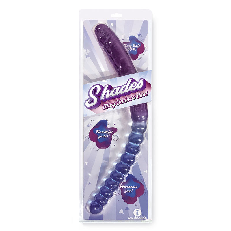 The image showcases a packaged adult toy named "Shades 17'' Jelly TPR Double Dong - Violet/Blue," featuring a seamless gradation from dark purple to light blue. The packaging emphasizes key features like "Body Safe Premium," "Beautifully Tinted," and "Phthalate-Free" with engaging graphics and text.