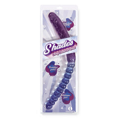 The image showcases a packaged adult toy named "Shades 17'' Jelly TPR Double Dong - Violet/Blue," featuring a seamless gradation from dark purple to light blue. The packaging emphasizes key features like "Body Safe Premium," "Beautifully Tinted," and "Phthalate-Free" with engaging graphics and text.