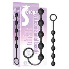 Packaging and product image of the S-Drops Silicone Anal Beads from the S Drops brand. The packaging highlights features such as medical-grade silicone, an ultra-smooth texture, an easy pull handle, and suitability for beginners. The product’s pull handle and pleasure-bumps in varying sizes ensure a comfortable experience.