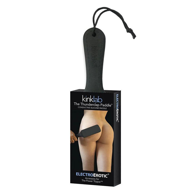 A retail package showcases KinkLab's "The Thunderclap Paddle," featuring a conductive silicon paddle with an image demonstrating its usage on a buttock. The black paddle, ideal for electrosex play, includes a wrist strap and is marketed under the "Electroerotic" collection by the brand "KinkLab".
