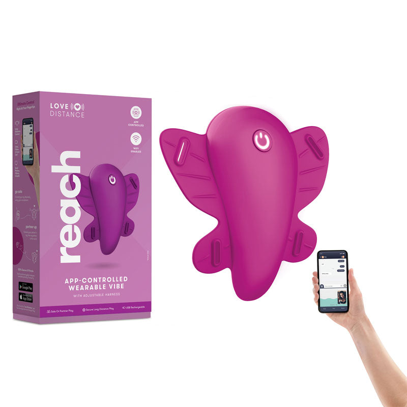 A purple, butterfly-shaped wearable vibe called the "Love Distance REACH Panty Vibrator" is displayed next to its packaging. A hand holds a smartphone showing the control app for the device. The box emphasizes powerful vibrating functions and wireless remote control features.