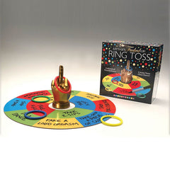 The "Lets Get Fucked Up Ring Toss" game features a hand making an offensive gesture as its centerpiece, surrounded by a colorful circular mat divided into sections with various dares. The box beside it is labeled "Let's Get F#cked Up! Ring Toss" and showcases an image of this rowdy party game—ideal for icebreakers and drinking games.