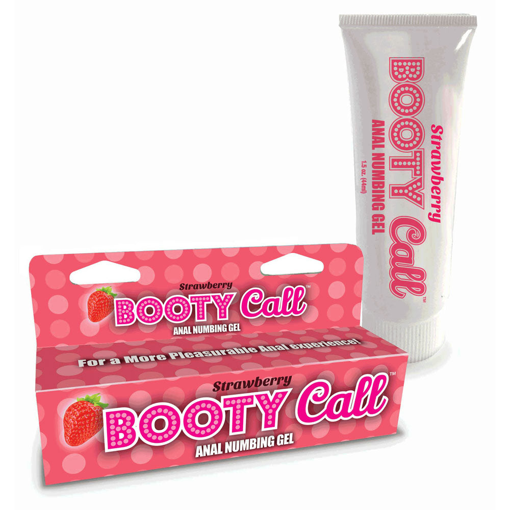 A tube and a box of "Booty Call Anal Numbing Gel - Strawberry" are displayed. The white tube with pink text and the pink box with white dots both feature the same product name and a strawberry graphic. The box reads, "For a More Pleasurable Anal Play Experience!