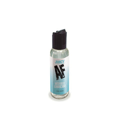 A small bottle of "Juicy AF" water-based lubricant with a black flip-top cap. The clear bottle features a light blue label and contains 59 ml (2 ounces) of lube. Ideal for use with sex toys and condoms, the design is simple and minimalistic.