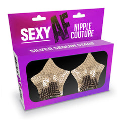 A product packaging displaying "Sexy AF - Nipple Couture Silver Stars" text. The package is purple with two star-shaped silver sequin nipple covers, made with skin-safe silicone adhesive and reusable nipple couture, visible through a transparent window.