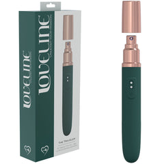 A photo of a personal massager and its packaging. The LOVELINE The Traveler Vibrator has a sleek green body with rose gold accents and a removable cap. The packaging displays the same massager and prominently features the brand name "Loveline" along with the product name "The Traveler" in large font, ideal for clitoral stimulation.
