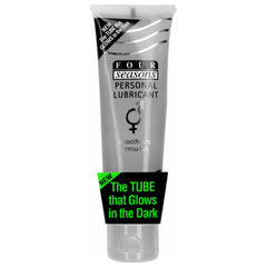 A translucent tube of Four Seasons Glow In The Dark Lubricant, adorned with a label proclaiming "Smooth and Sensuous." The packaging includes a note that says "The Tube that Glows in the Dark" along with a small circular indicator at the top highlighting this feature.