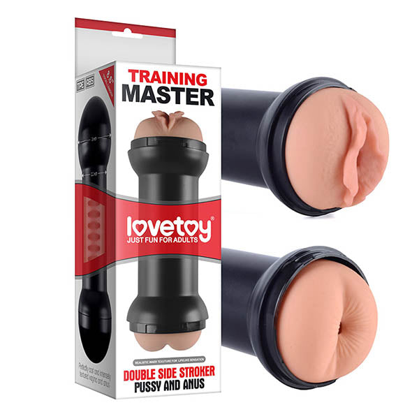 An image of a packaged adult toy branded as "Training Master Double Side Stroker - Pussy & Ass Double Sided Stroker Masturbator" by Lovetoy. The product features a real feel masturbator with a double-sided stroker design, offering both vaginal and anal entries. This cylindrical, black toy includes realistic internal ribbed textures and is best used with water-based lubricant. It is shown out of its box from two angles.