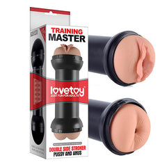 An image of a packaged adult toy branded as "Training Master Double Side Stroker - Pussy & Ass Double Sided Stroker Masturbator" by Lovetoy. The product features a real feel masturbator with a double-sided stroker design, offering both vaginal and anal entries. This cylindrical, black toy includes realistic internal ribbed textures and is best used with water-based lubricant. It is shown out of its box from two angles.