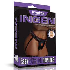 The image depicts the packaging for the "Ingen Easy Black Adjustable Strap-On Harness (No Probe Included)" by Lovetoy. The black box, embellished with purple accents, features a photo of a person wearing this comfortable strap-on. The text emphasizes its user-friendly adjustable straps and stretchy webbing designed to fit waist sizes ranging from 24 to 56 inches.