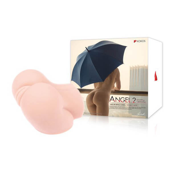 A product image showcasing the "Kokos Mini Butt Angel 2 - Flesh Mini Doggy-Style Masturbator" packaging from KOKOS, aimed at depicting an adult toy. The box features a figure holding a dark umbrella. The toy, in a light skin tone, with internal creases for a realistic feeling, is displayed next to the box.