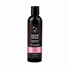 A black bottle of Earthly Body's Hemp Seed Massage & Body Oil labeled "Zen Berry Rose," adorned with pink and white details. This 8-ounce (237ml) vegan product features a black flip-top cap, created by the natural oils company Earthly Body.