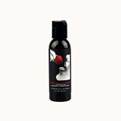 Black spray bottle with a white graphic of a hand giving a massage, and text that reads 'Edible Massage Lotion' and 'Strawberry'.