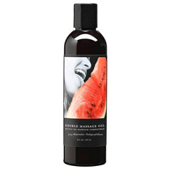 The Edible Massage Oil - Juicy Watermelon Flavoured - 237 ml Bottle is a black plastic container with a black cap, holding natural massage oil. The label showcases an image of a person about to bite into a slice of watermelon and reads, "Edible Massage Oil - Juicy Watermelon." Made with a vegan edible formulation and vitamin-rich oils, the bottle contains 8 fl oz or 237 ml.