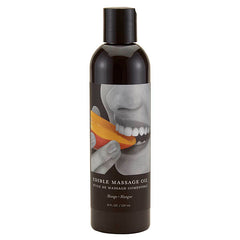 A black bottle labeled "Edible Massage Oil - Mango Flavoured" featuring a photo of someone biting into a mango. The 237 ml (8 fl oz) bottle boasts a vegan, edible formulation with the delightful essence of mango.