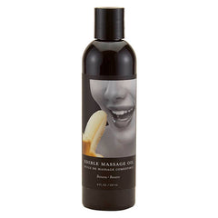 A 237 ml bottle of Earthly Body Edible Massage Oil with a banana flavour theme on the label.