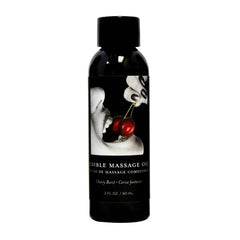 Bottle of Edible Cherry Massage Oil by Earthly Body, with a black cap and label featuring an illustration of a cherry and a silhouette of a person's head.