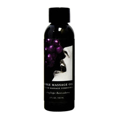 A sleek black bottle labeled "Edible Grape Massage Oil 60ml," adorned with an image of a woman's face near a bunch of grapes. Highlighting its blend of vitamin-rich oils, the text "2 FL OZ / 60 mL" is displayed at the bottom of the label.