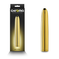 Image of a gold-toned, water-resistant bullet vibrator standing upright next to its packaging. The sleek, cylindrical, metallic "Chroma Vibrator - Gold" sits in front of a black box with the brand "nsnovelties" visible. This multi-speed function marvel promises versatility and elegance.