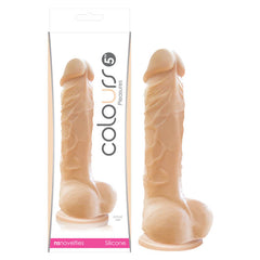 A packaged lifelike silicone dildo from Colours - Pleasures by NS Novelties. Made from medical-grade silicone, the beige dildo boasts a textured surface with realistic veins and a secure suction cup base. The packaging is made of clear plastic with product details on the label.