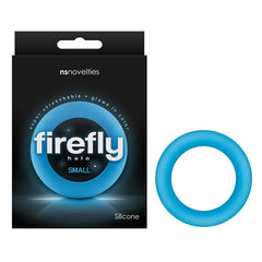 The image shows a blue silicone ring labeled "Firefly Halo Cock Ring - Small Blue" on its packaging. The black package with white text mentions that the ring is "super stretchable" and "glows in color." Promising an enhanced climax, the glow-in-the-dark cock ring is by NS Novelties, whose name appears at the top of the package.