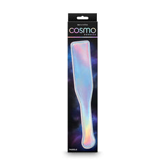 Image of the packaging for the Cosmo Bondage Paddle - Rainbow by NS Novelties. The paddle, crafted from easy-to-clean vinyl and boasting a shiny, iridescent finish, is displayed prominently in the center of the box against a dark gradient background, with the product name and brand at the top.
