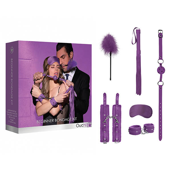 The Ouch! Beginners Bondage Kit - Purple - 5 Piece Set is an ideal addition to your sex life essentials, offering a feather tickler, wrist and ankle cuffs, a ball gag, a blindfold, collar and leash, and a flogger. The packaging displays an image of a couple engaged in bondage play. Both the kit and its box are showcased against a white background.