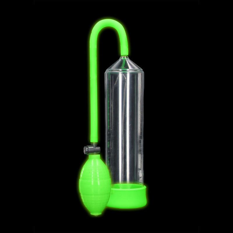 The OUCH! Glow In The Dark Classic Penis Pump is a transparent cylindrical device featuring a vivid green pump and tubing, typically utilized as a vacuum pump. This multi-functional tool is also popular among bondage products for specialized applications.