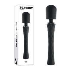 Photograph of the Playboy Pleasure ROYAL Wand Vibrator, a black vibrating wand with a textured handle, shown both in its packaging and alongside it. The sleek, vertically oriented design features a cylindrical head made from body-safe silicone. The packaging includes text and the iconic Playboy bunny logo.