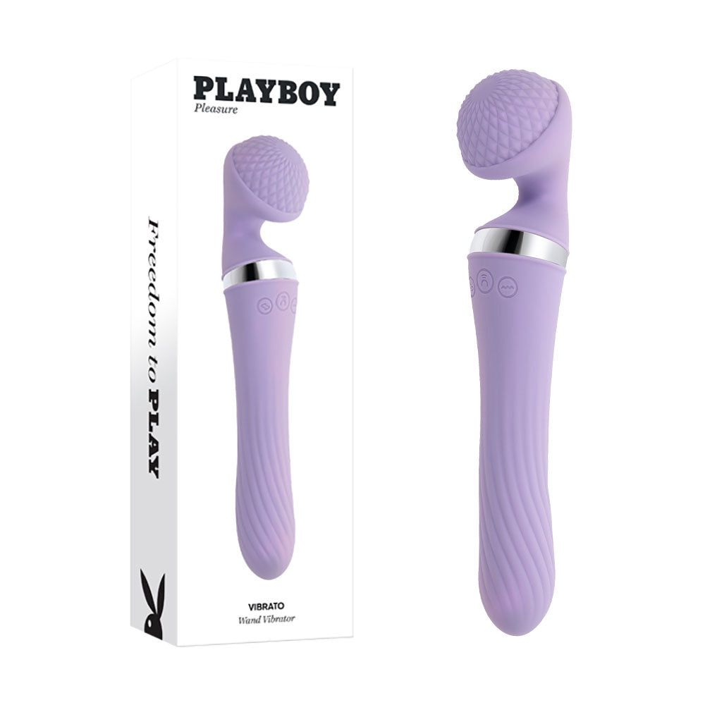The Playboy Pleasure VIBRATO Vibrating Wand is a lavender-colored, dual-ended massager with a textured rounded head and smooth handle. It features buttons on the side and offers multiple vibrating speeds. Made from body-safe silicone, this product is displayed next to its white box labeled "Playboy Pleasure" with the phrase "Freedom to Play" on the side.