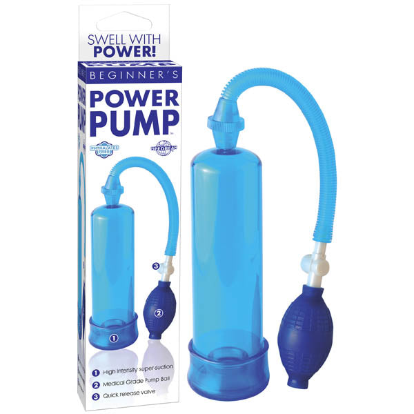 A blue vacuum pump labeled "Beginner's Power Pump - Blue Penis Pump" is displayed beside its packaging. The device features a transparent cylinder connected by a flexible blue tube to a medical-style pump ball, promising rock-hard erections. The packaging includes product information and the slogan "Swell with Power!