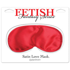 The image features a packaged product labeled "Fetish Fantasy Series Red Satin Love Mask" by Pipedream. The red satin mask is designed to cover the eyes, potentially enhancing heightened sensory awareness. The packaging is primarily white with red and black text.
