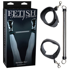 A product image for the Fetish Fantasy Series Limited Edition Spreader Bar by Pipedream. The image shows the packaging featuring legs with adjustable ankle cuffs spread apart by a Beginner's metal spreader bar, along with close-ups of the metal bar and two soft neoprene restraints.