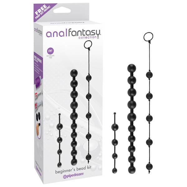 A product image of the "Anal Fantasy Collection Beginner's Anal Bead Kit" by Pipedream. The image features the packaging box on the left and four distinct sets of black anal beads with flexible shafts, each differing in size and design, on the right. The box emphasizes that it is free of certain chemicals.