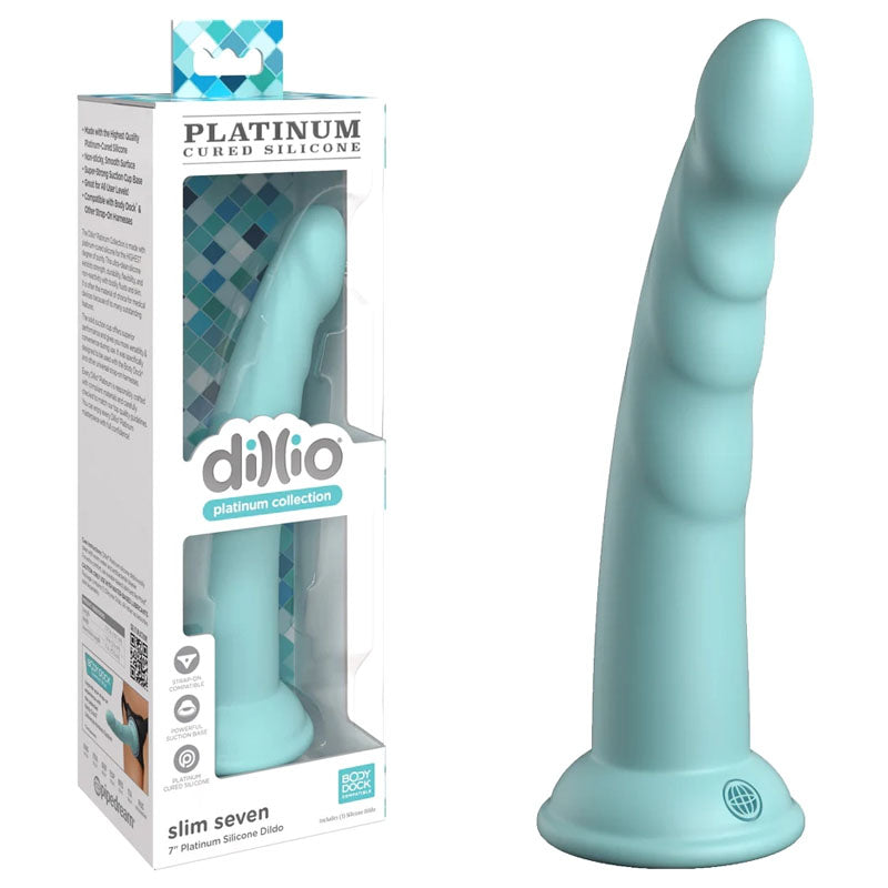 A product image of the Dillio Platinum Slim Seven - Teal, a mint green silicone dildo with a slight curve and ridged texture. Made from Platinum-cured silicone, the dildo features a strong suction cup at the base and is displayed next to its packaging, which highlights the brand name "dillio" along with product details.