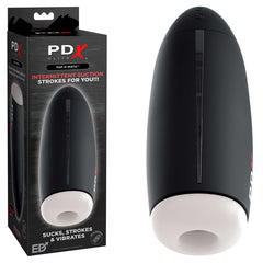 Image of a Pipedream Extreme Toys Elite Fap-O-Matic male masturbator in its packaging on the left and the device removed from packaging on the right. The black, cylindrical device features a white opening at one end and promises functions such as powerful vibration modes, sucking, stroking, and vibrating with its Fanta Flesh sleeve.
