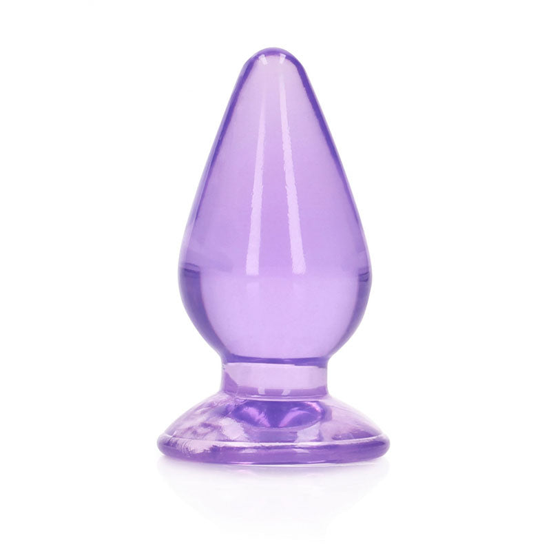 The REALROCK 11.5 cm Anal Butt Plug - Purple features a smooth, tapered design alongside a flared base. Crafted from shiny, body-safe material, it offers a sleek and polished appearance with its translucent purple finish.
