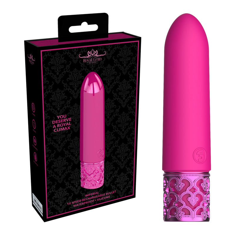 The ROYAL GEMS Imperial - Silicone Rechargeable Bullet, a bright pink, bullet-shaped personal massager made of medical grade silicone, is shown next to its packaging. The massager has an ornate, textured base and is displayed vertically. The black box features an image of the rechargeable vibrator and text that reads, "You deserve a royal climax.