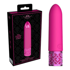 The ROYAL GEMS Imperial - Silicone Rechargeable Bullet, a bright pink, bullet-shaped personal massager made of medical grade silicone, is shown next to its packaging. The massager has an ornate, textured base and is displayed vertically. The black box features an image of the rechargeable vibrator and text that reads, "You deserve a royal climax.